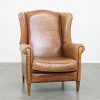 Charmante, Tijdloze En Karaktervolle Rundleren Oorfauteuil In Een Lichte Cognac Kleur thumbnail 10